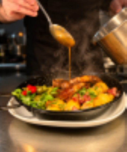 Hungarian-style pork steak, garlic jus, roasted potatoes, fermented cucumber